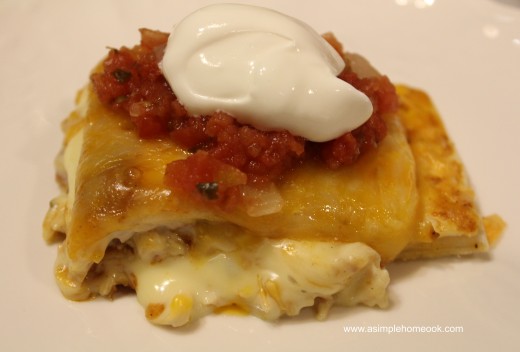 chicken and cheese enchilada topped