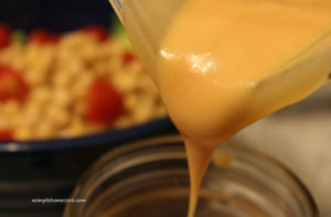 creamy french dressing being poured