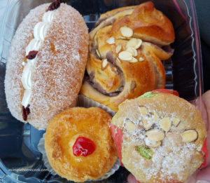 four sweet hut baked goods filled and cupcake