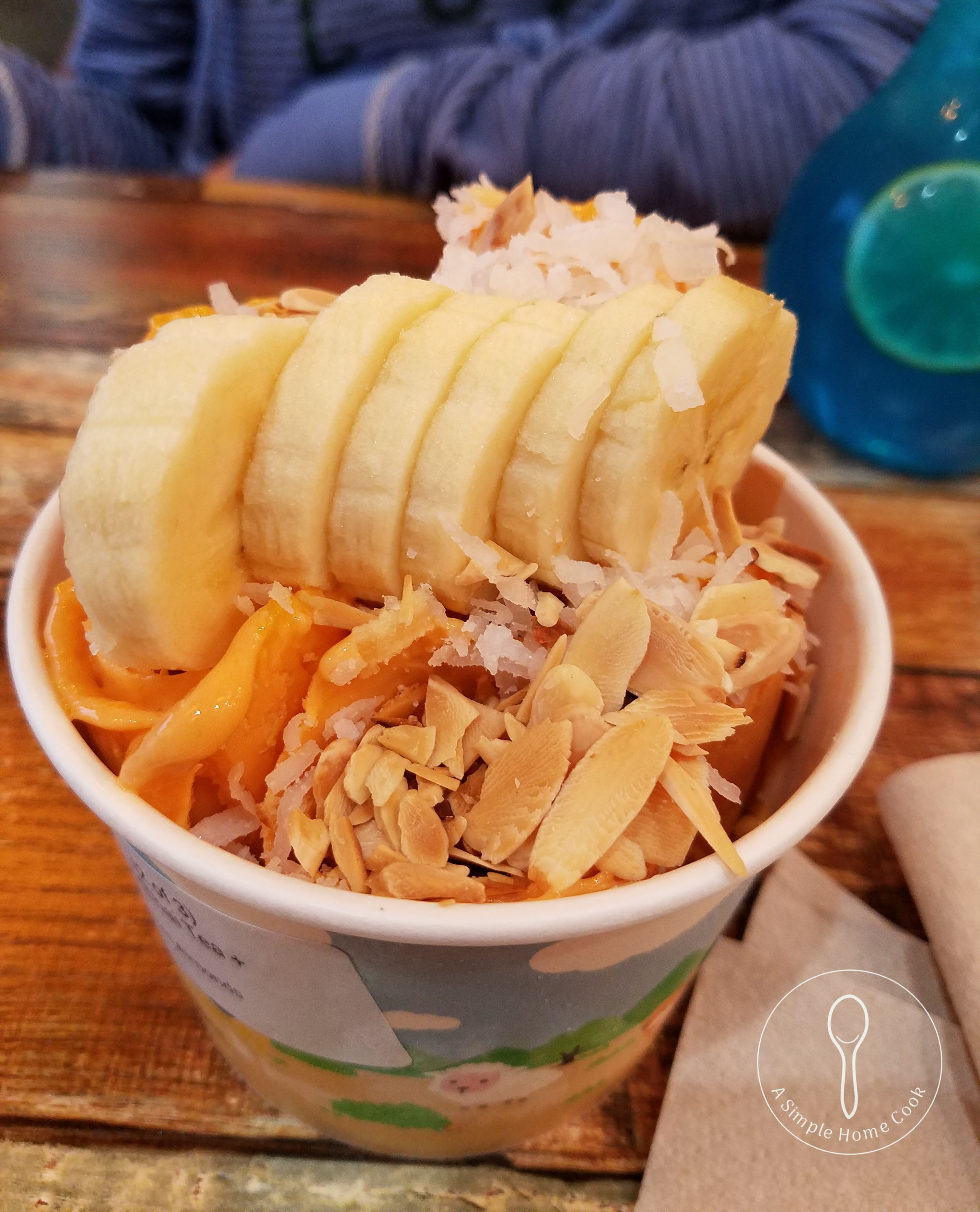 ice cream rolls topped with bananas and nuts